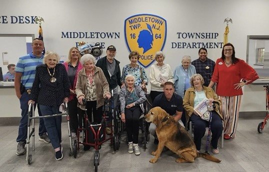 Group photo of Arbor Terrace employees and residents with MTPD officers