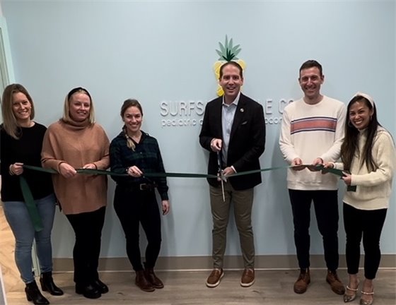 Group photo of ribbon cutting