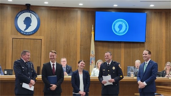 Photo of Deputy Chiefs, Mayor Perry, and officers Sarah and Kenny laughing