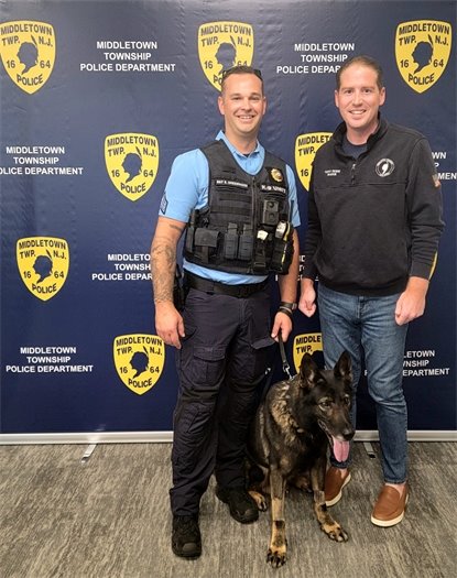 Mayor Perry, Sergeant Stephen Greenwood, and K-9 Koda