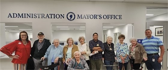 Group photo of Arbor Terrace employees and residents with MTPD officer