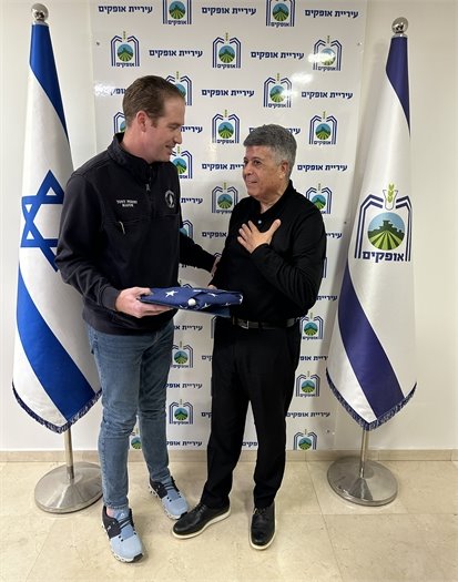 Mayor Itzik Danino gets choked up after receiving the American flag from Mayor Tony Perry.