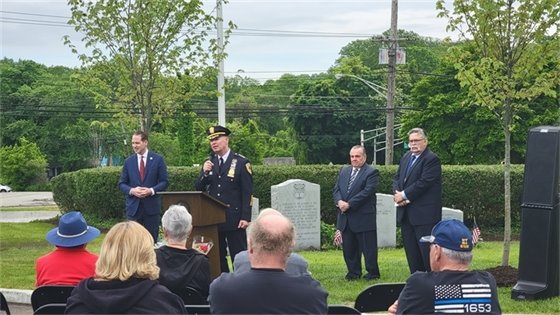 Photo of Chief Weber and Mayor Perry at podium