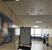 Sign from HS set saying "Welcome to Mean Girls The Musical"