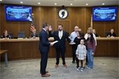 Committeeman Ryan Clarke gets sworn in by Mayor Tony Perry.