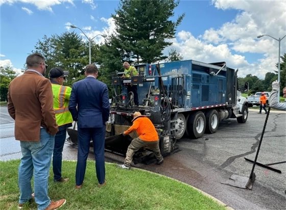 Photo of Mayor Tony Perry and Committeeman Ryan Clarke looking at the equipment